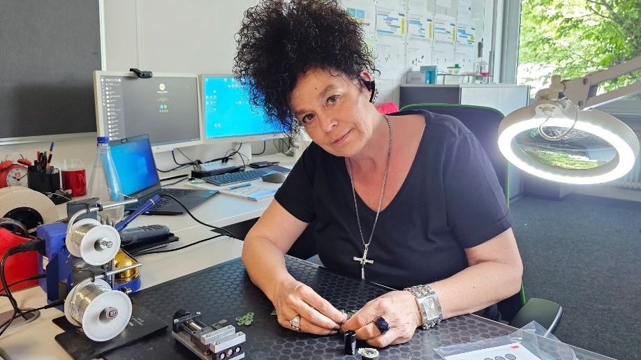 Christina is a design-to-cost Expert at Pepperl+Fuchs. Here she is sitting at her workplace.